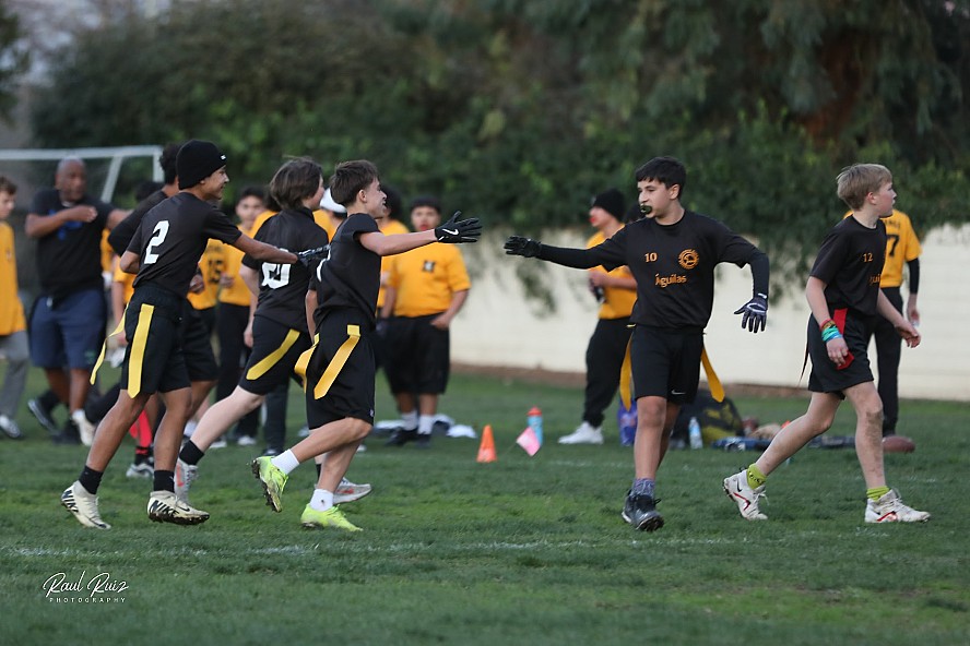 Students playing flag football