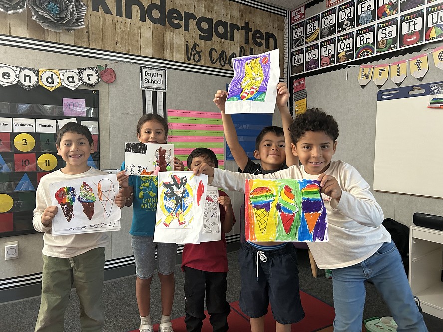 Students show off their colorful artwork