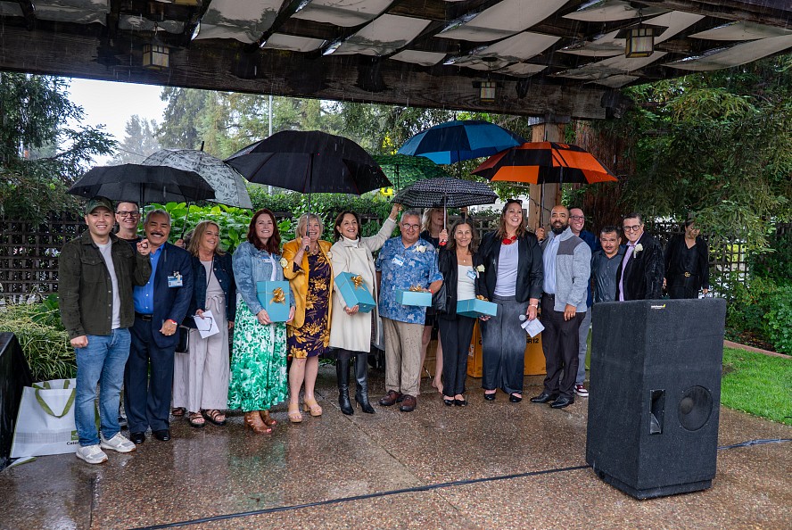 CUSD's 2026 retirees gather together in the rain for a retirement celebration