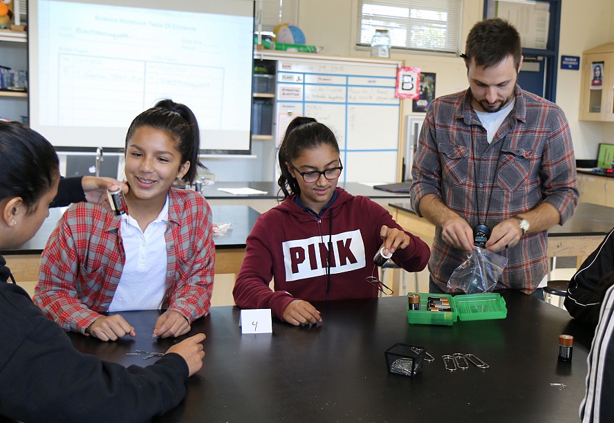 students doing a science experiment