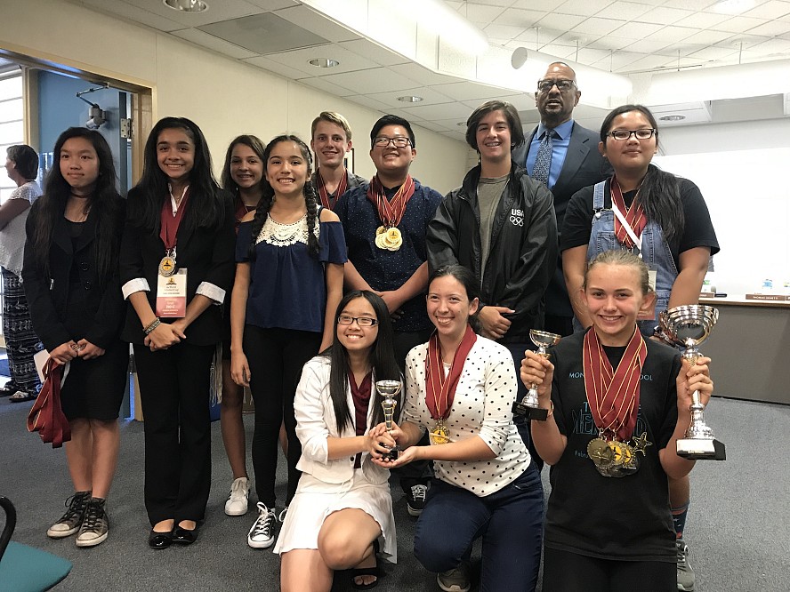 members of Monroe's Scholars Cup team at board meeting