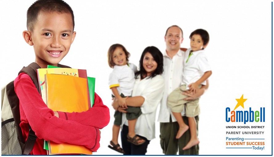 smiling student with family behind him