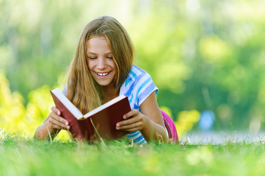 girl reading in park