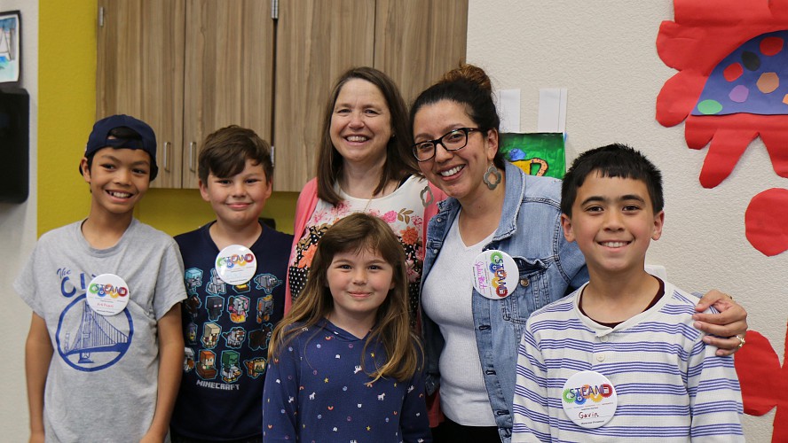 happy students with teacher
