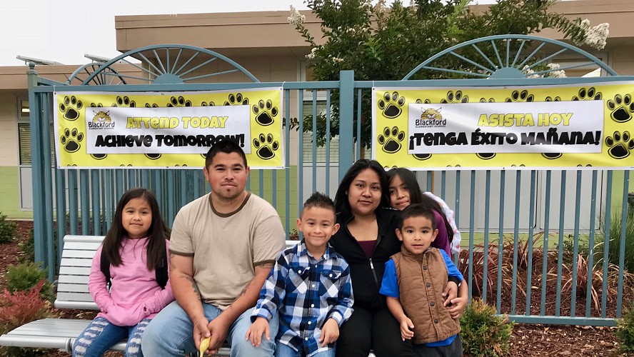 family waits for the morning school bell