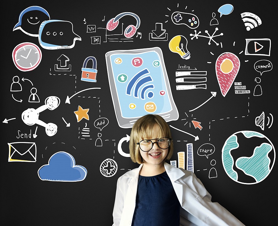 girl stands in front of board with internet symbols