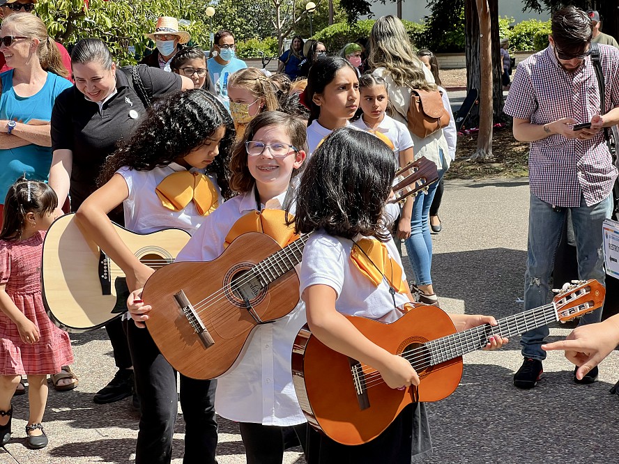 line of students with guitars smiling