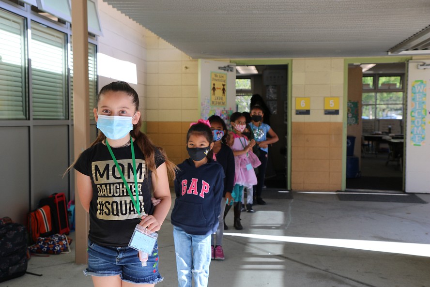 students line up outside classroom