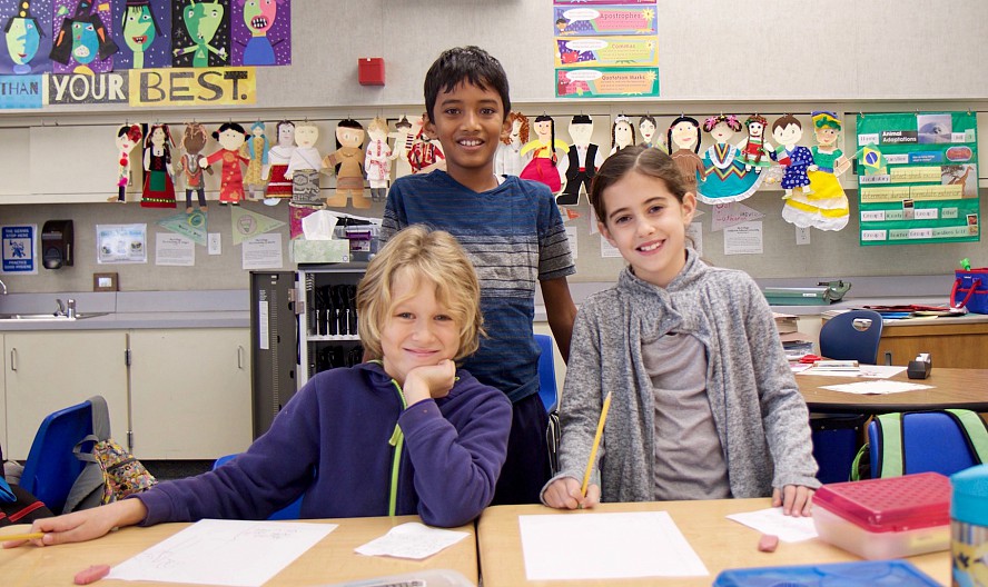 three students smiling