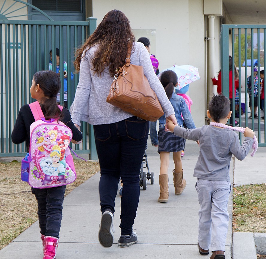 Parents and students walk to school