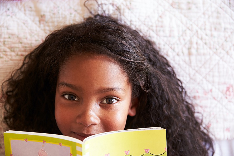 happy girl reading a book