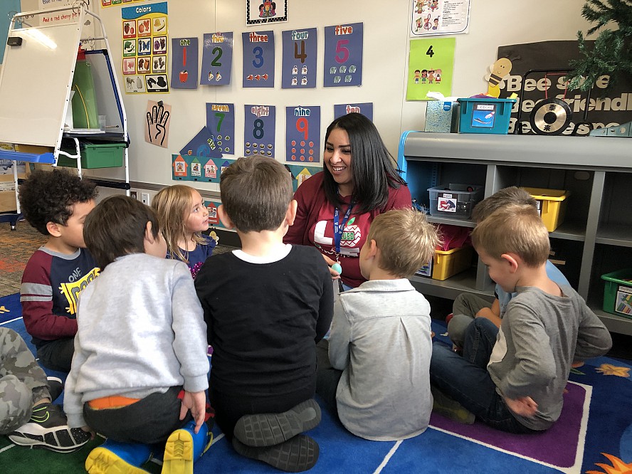 preschool teachers with students