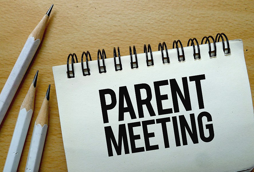 notebook that says: Parent Meeting