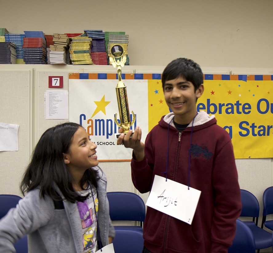 two students with trophy