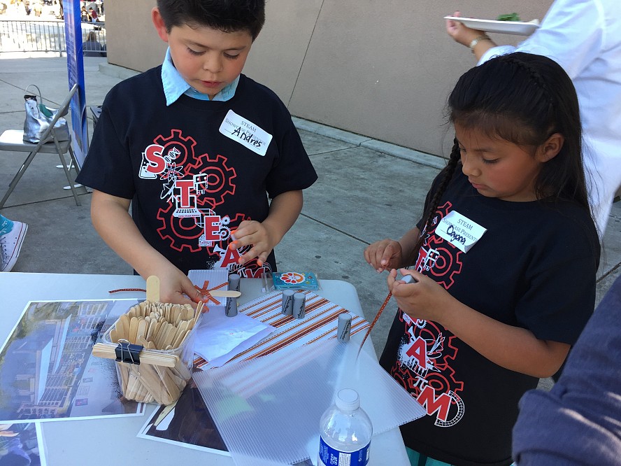 children working on a project requiring art, science and math