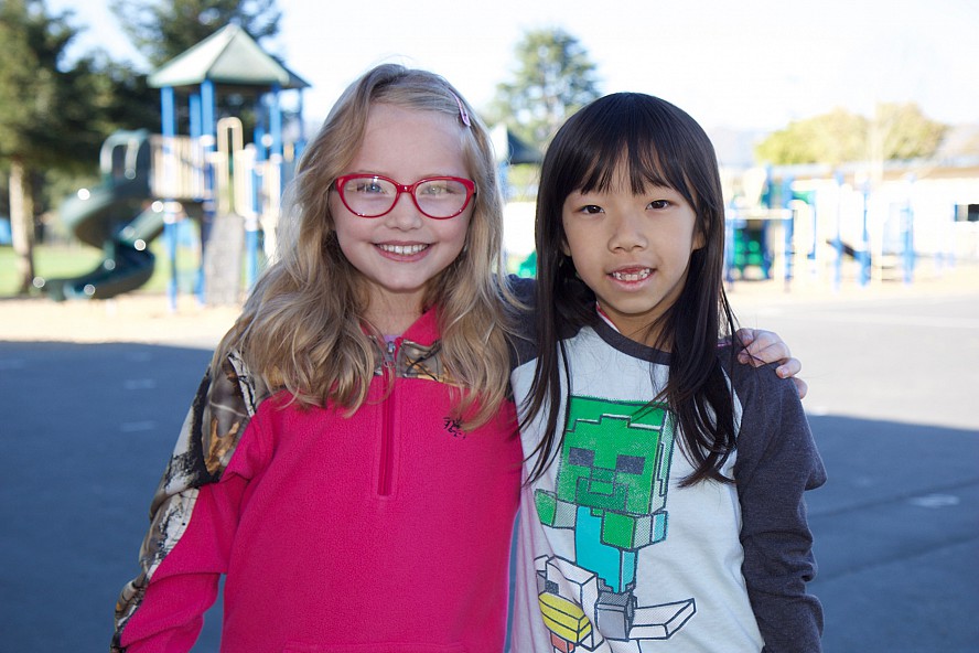 two girls smiling