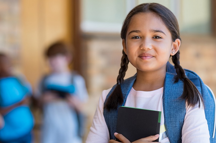 school girl smiling at camera