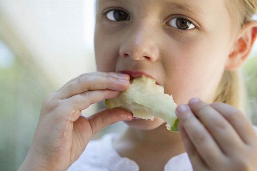 girl eating fruit