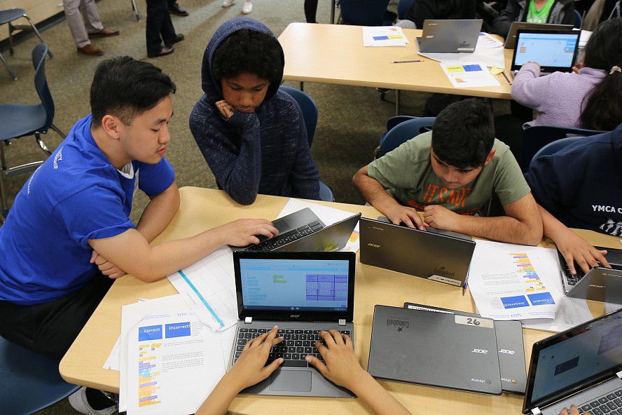 students learn coding with help from college student
