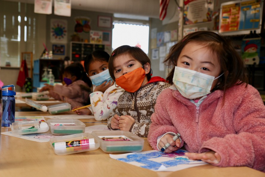 three tk students in classroom