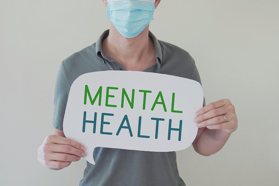 man holding a sign that reads 