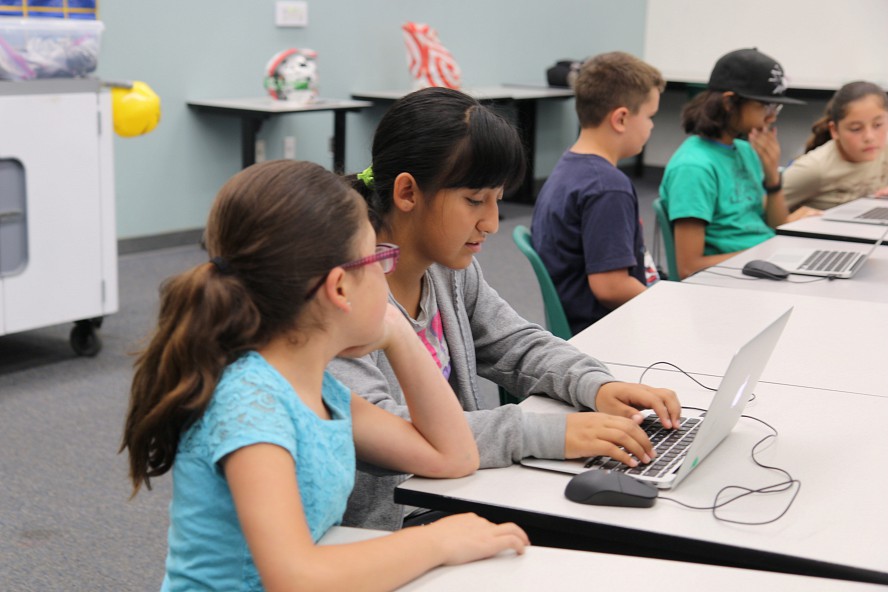 students work on coding for the Zero Robotics challenge