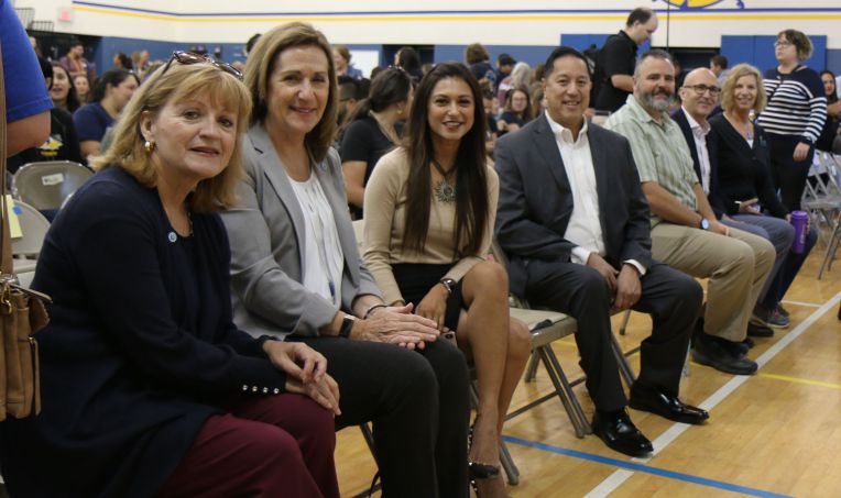 civic leaders seated at event