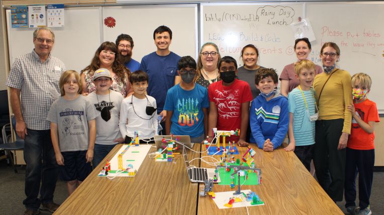 groups of children and teachers smiling