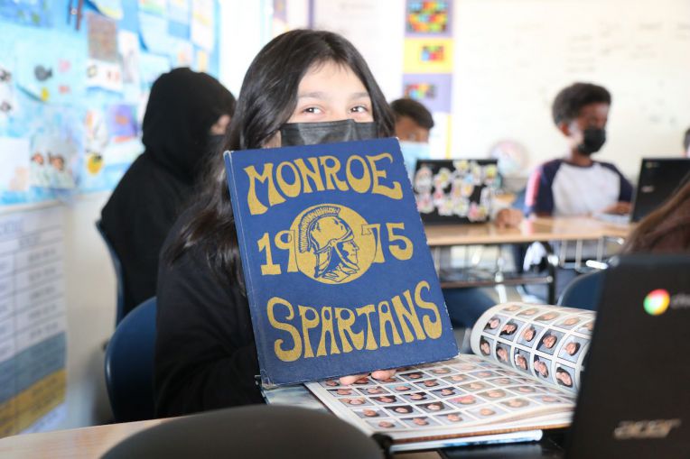 girl with old yearbook