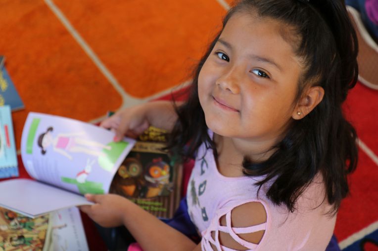 smiling girl with books