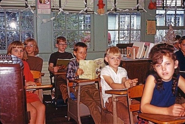 old photo of students sitting in rows