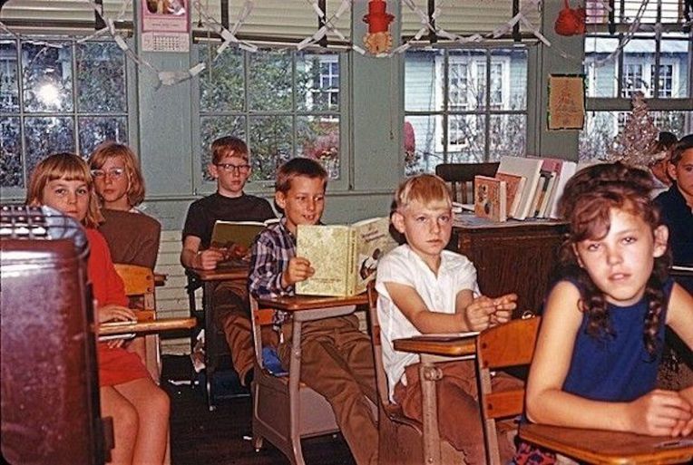 old photo of students sitting in rows