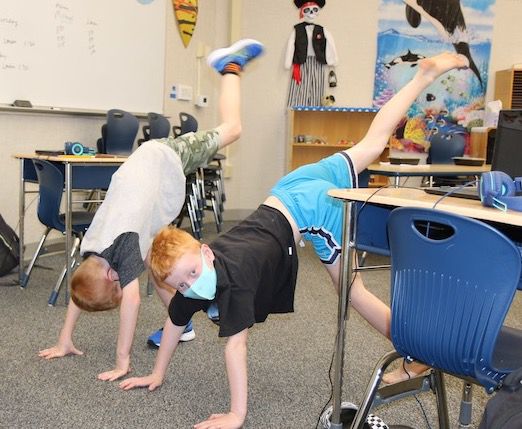 two boys doing yoga