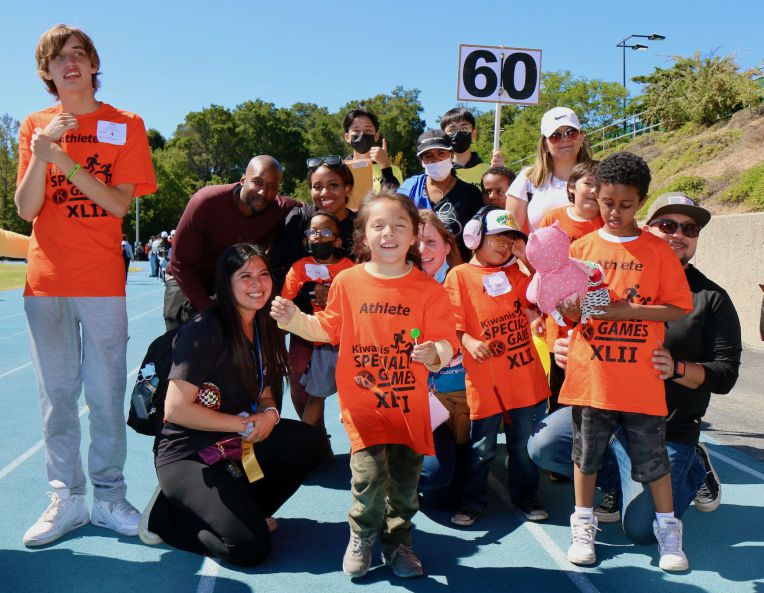 special games students pose with volunteers